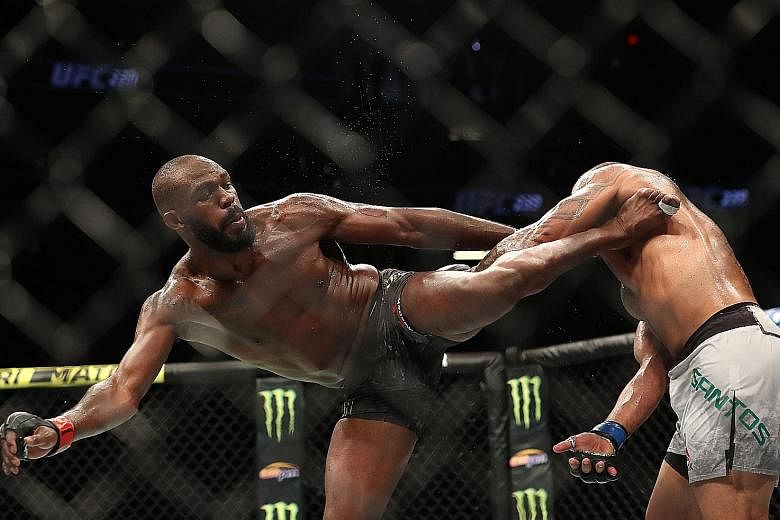 American MMA star Jon Jones kicking Brazilian Thiago Santos during their UFC title bout at T-Mobile Arena in Las Vegas on Saturday. Jones, who turns 32 on July 19, says if his body holds up, he would like to keep fighting for "another two to four yea