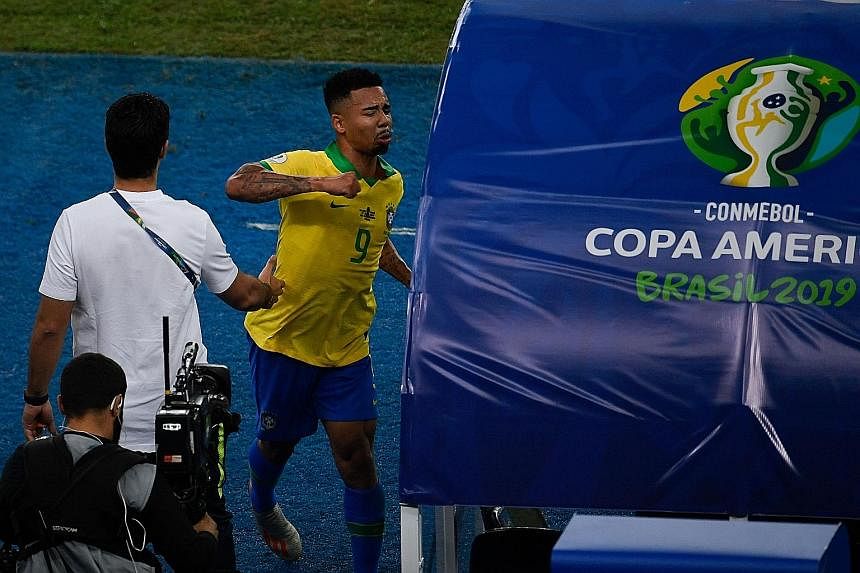 Brazil captain and Golden Ball winner Dani Alves hoisting the Copa America trophy after the hosts defeated Peru 3-1 in the final at the Maracana on Sunday. It was the Selecao's ninth triumph in the continental competition. Gabriel Jesus taking out hi
