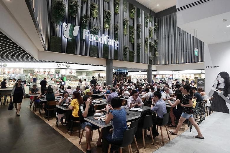 FairPrice, NTUC Foodfare (above) and Kopitiam will accept other forms of verification for Merdeka Generation discounts till July end. ST PHOTO: KELVIN CHNG