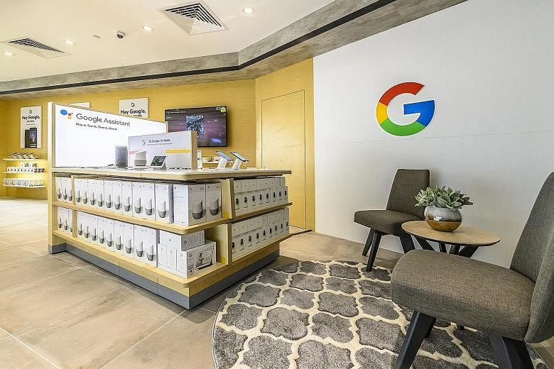 Courts Singapore chief executive Ben Tan at its new 12,000 sq ft store (left) in Funan mall, which houses a Google experience zone (right) as well as a Samsung smart home experience zone.