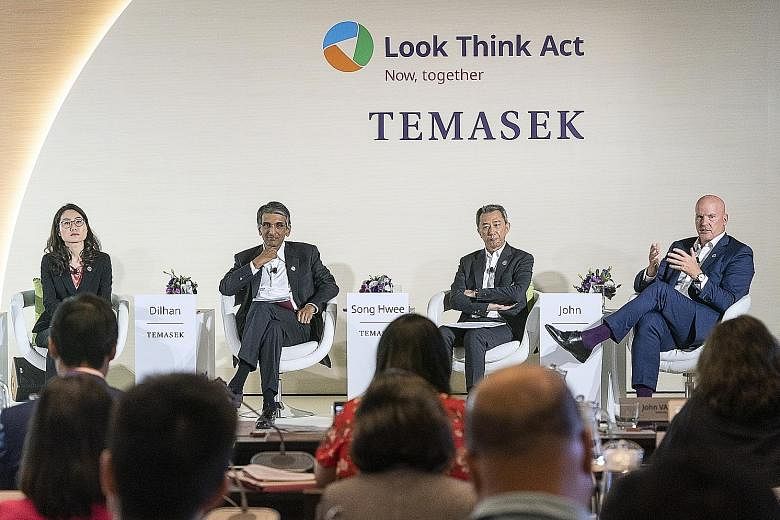 Senior Temasek executives at the briefing yesterday: (from left) Ms Png Chin Yee, head of financial services and senior managing director of portfolio strategy and risk group; and Temasek International's chief executive Dilhan Pillay Sandrasegara, pr