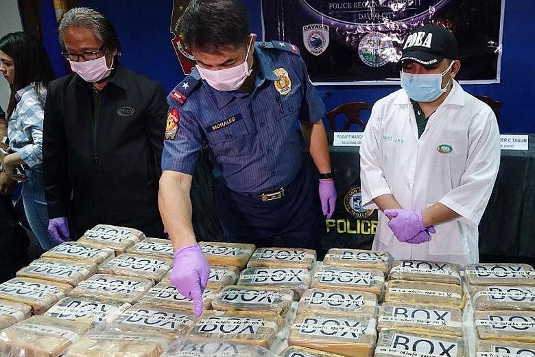 Philippine National Police in Davao City showing the media bricks of cocaine that washed up along the coastlines. Law enforcers say such finds recently point to a dramatic rise in the use of drug routes that cross the Pacific from the United States a