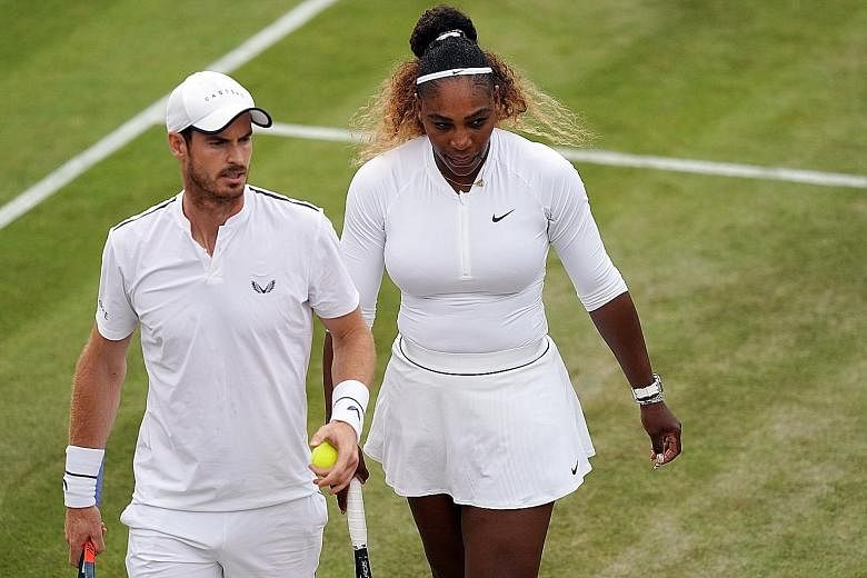 Andy Murray and Serena Williams during their third-round mixed doubles loss to top seeds Bruno Soares and Nicole Melichar yesterday.