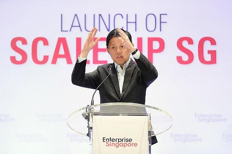 Trade and Industry Minister Chan Chun Sing speaking at the launch of the Scale-up programme yesterday. He urged firms that have been given a leg-up to create better jobs.
