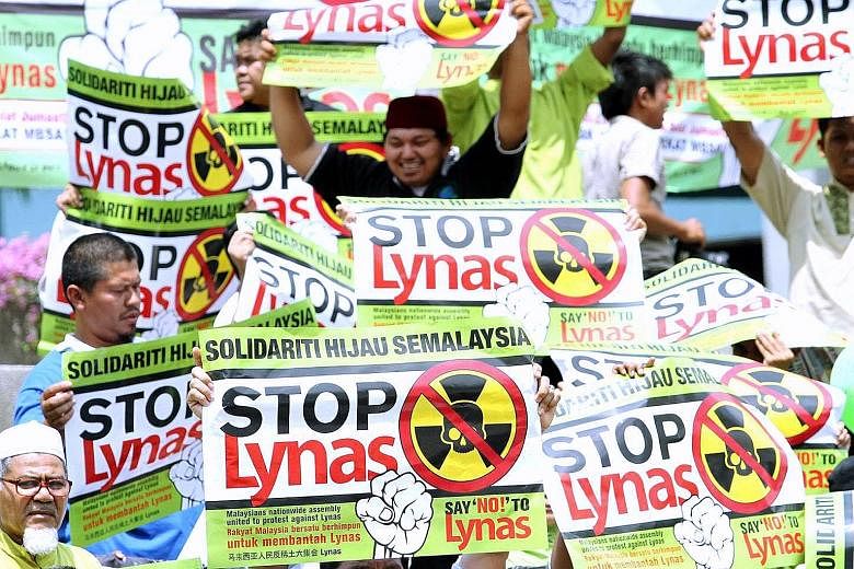 Activists campaigning in Shah Alam against the construction of a Lynas rare earth plant in April 2012. Rallies were held in 11 cities, including Kuantan where the plant is sited. Despite the protests, the plant opened at the end of the year. PHOTO: T