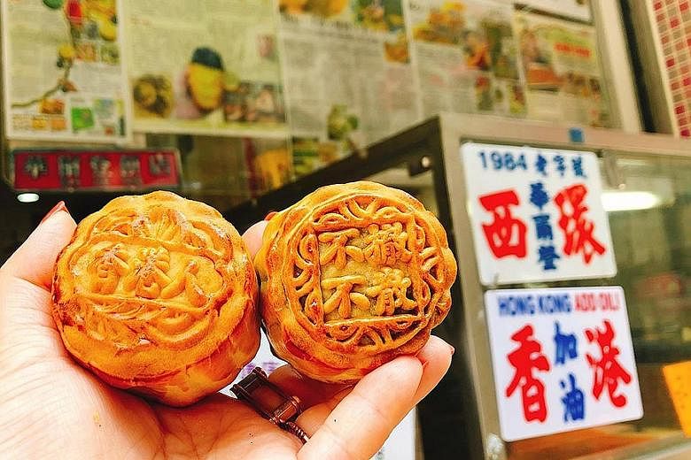 Mooncakes from the Wah Yee Tang Cake Shop that read "Hong Kongers" (far left) and "no withdrawal, no dispersal". The mooncakes have sold out every day since the shop began offering them on Monday.