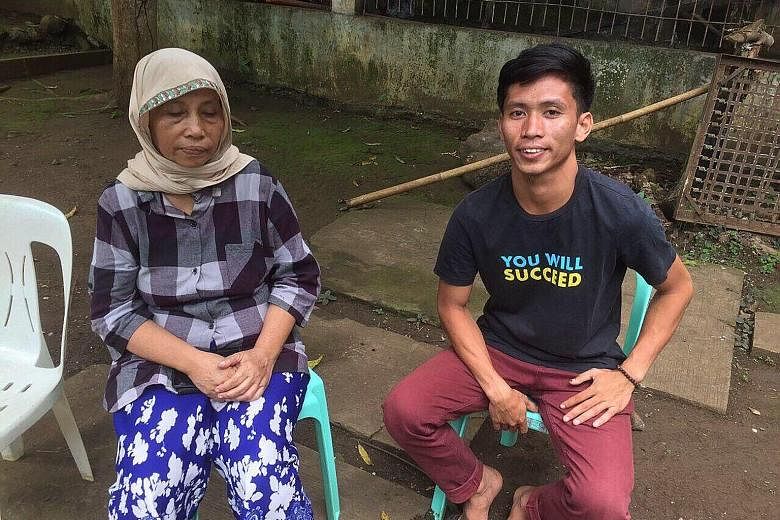 Filipino suicide bomber Norman Lasuca, 23, with his mother Vilman Lasuca, who came forward to claim his remains on July 1. Tissue samples taken from both of them for DNA testing confirmed that he was her son. PHOTO: ARMED FORCES OF THE PHILIPPINES