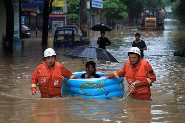 Heavy rain, floods in China force evacuation of nearly 80,000 | The ...