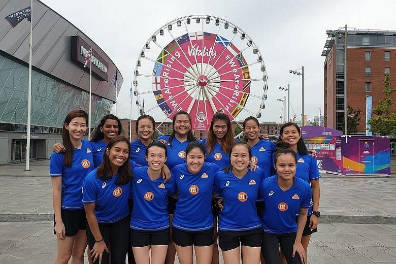 Charmaine Soh (back, left) and Kimberly Lim (front, centre), with teammates outside the Netball World Cup venue M&S Bank Arena in Liverpool, are the only two Singapore players with experience at this level.