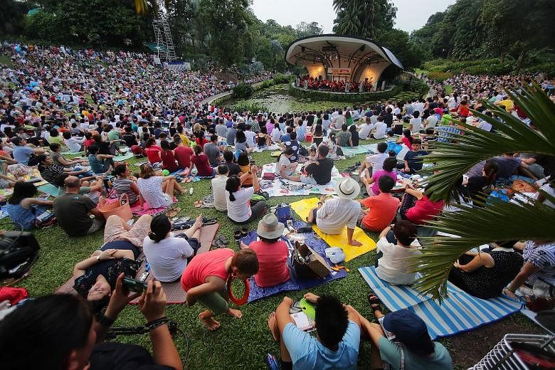 Attendees at the Straits Times Concert in the Gardens last year. The hour-long concert this year will see the Singapore Symphony Orchestra performing a selection of classics. Freebies will be distributed from 4pm. ST FILE PHOTO