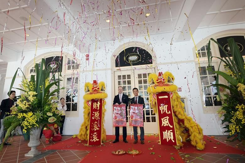 Mr Christian Westbeld, general manager of Raffles Hotel Singapore, and Mr Keith Tan Kean Loong, chief executive of Singapore Tourism Board, at the opening ceremony of the Raffles Arcade yesterday. The Raffles Boutique at the newly opened Raffles Arca