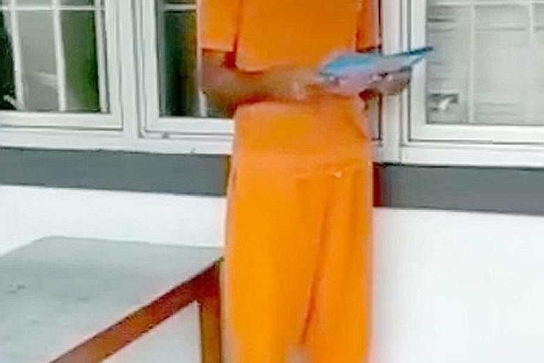 A screen grab showing Mohammad Hassan Saynuddin reading his statement while dressed in prison garb. PHOTO: GOVERNMENT OF INDONESIA