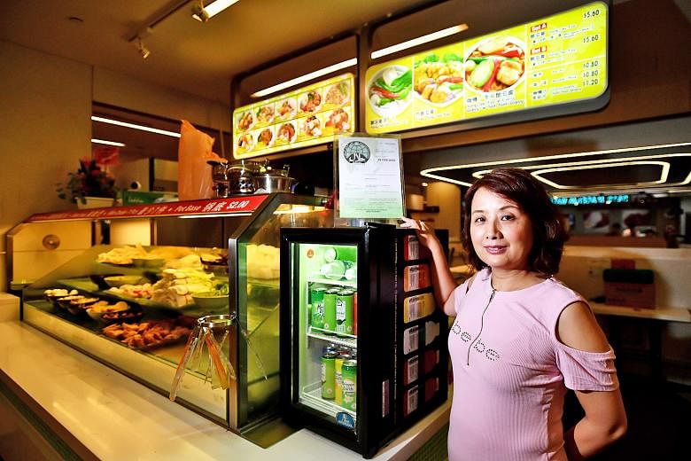 Ms May Liu, owner of halal-certified yong tau foo stall Green Delights at Westgate mall. False online claims last year led to a fall in sales, although a probe by Muis found the stall followed proper food-handling procedures.