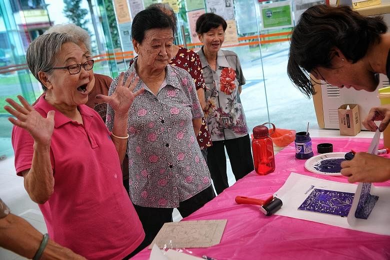 Senior citizens learning linocut as part of their printmaking lesson with artist Felicia Low at NTUC Health SilverACE (Taman Jurong) earlier this month.