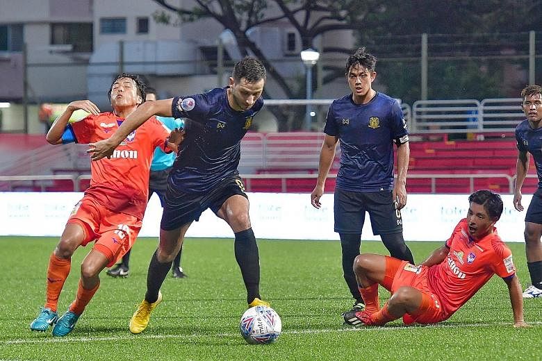 Hougang United striker Stipe Plazibat outmuscling Albirex Niigata captain Kyoga Nakamura in their Singapore Premier League match at the Jurong East Stadium yesterday. Hougang won 2-1 with Plazibat scoring twice, in the 25th and 31st minutes. ST PHOTO