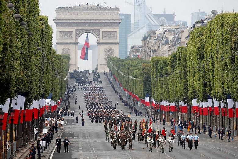 European troops marching down Champs-Elysees Avenue during the traditional Bastille Day military parade in Paris yesterday.