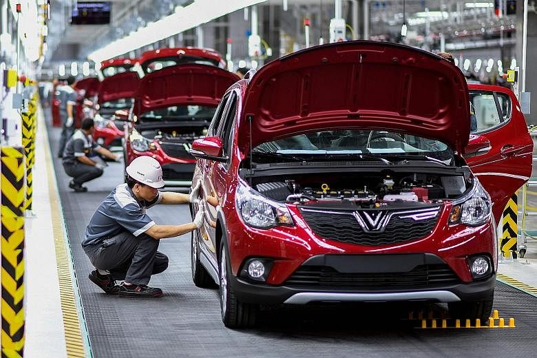 Workers at the assembly line of the new plant of VinFast, Vietnam's first home-grown car manufacturer. Analysts have singled out Vietnam as a clear winner of US tariffs on China. US imports of dutiable products from the country surged 29 per cent in 