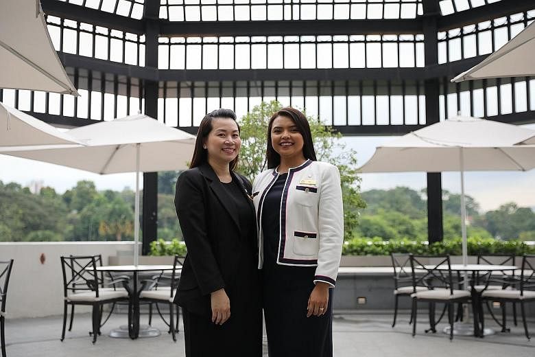 Grand Park City Hall sales staff Davina Yong (left) and Ida Jaafar have benefited from the hotel's efforts to improve working conditions. ST PHOTO: ONG WEE JIN