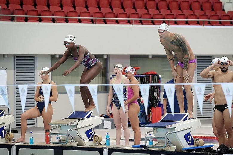 Simone Manuel preparing to plunge into the pool while practising at the OCBC Aquatic Centre with the US swim team last Saturday. The Americans were training in Singapore ahead of the Fina World Championships in South Korea.