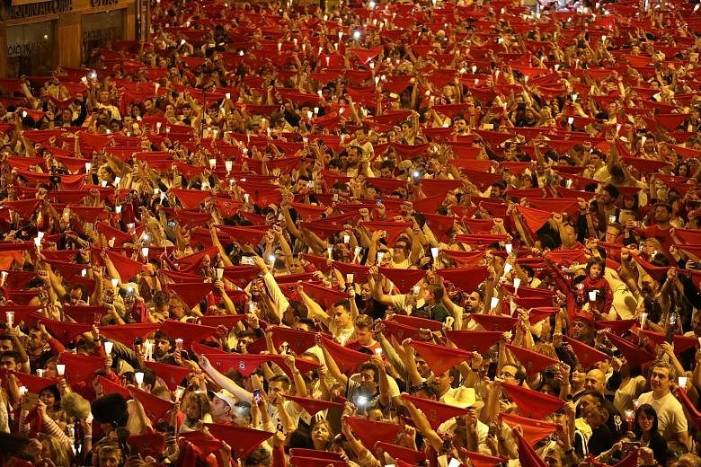 Thousands of swaying revellers raised candles and scarves as they sang a mournful song to mark the end of Spain's most famous bull running festival in Pamplona, which saw eight daredevils gored this year. "Poor me, poor me, the San Fermin fiesta has 