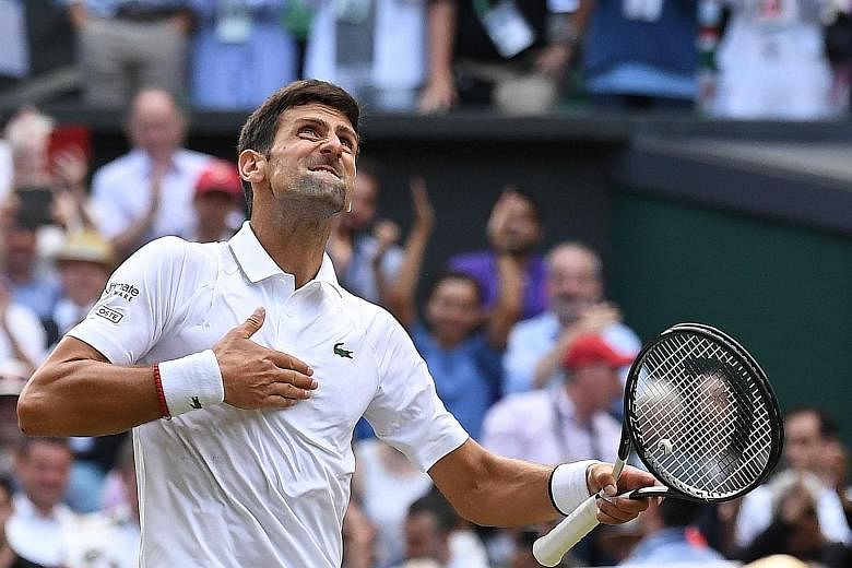 Left: Novak Djokovic celebrates beating Roger Federer in an epic Wimbledon final on Sunday. It was the Serb's fifth win, trailing only Federer (8) and Pete Sampras (7). Above: A runner-up plate was scant consolation for Federer who had two match poin
