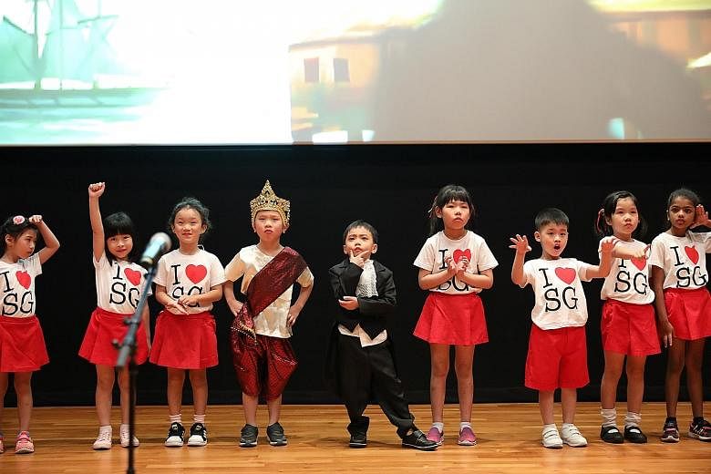 Children from PCF Sparkletots performing a skit at the National Museum of Singapore's Gallery Theatre yesterday about Singapore's past, present and future. The skit was among the performances that kicked off this year's Joy of Reading programme.