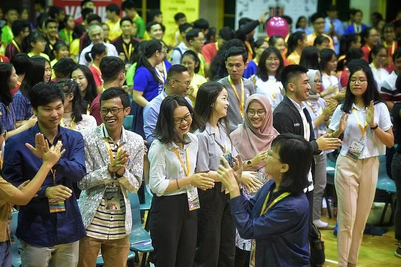 Above: Asean youth delegates and local student leaders attending the 11th Global Youth Leaders' Summit at Yio Chu Kang Secondary School yesterday. Left: Top voice artist Pocholo Gonzales spoke to the students yesterday.