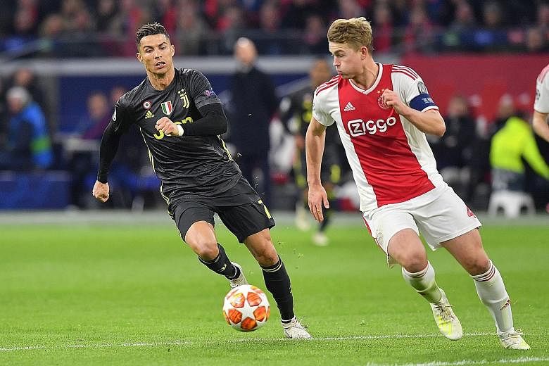 Juventus' Cristiano Ronaldo, seen chasing Ajax's Matthijs de Ligt during their Champions League quarter-final tie in April, can look forward to lining up alongside the Dutch defender in Italy next season. De Ligt is poised to sign for the Italian cha