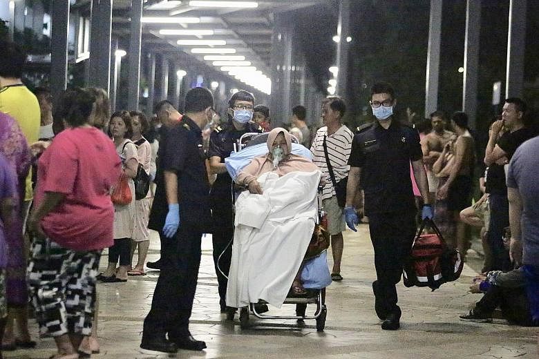 Those injured as a result of Monday night's fire in Boon Lay were taken to Ng Teng Fong General Hospital. The Singapore Civil Defence Force is investigating the cause of the blaze. PHOTO: SHIN MIN DAILY NEWS Left: The gutted flat belonging to Mr Che 