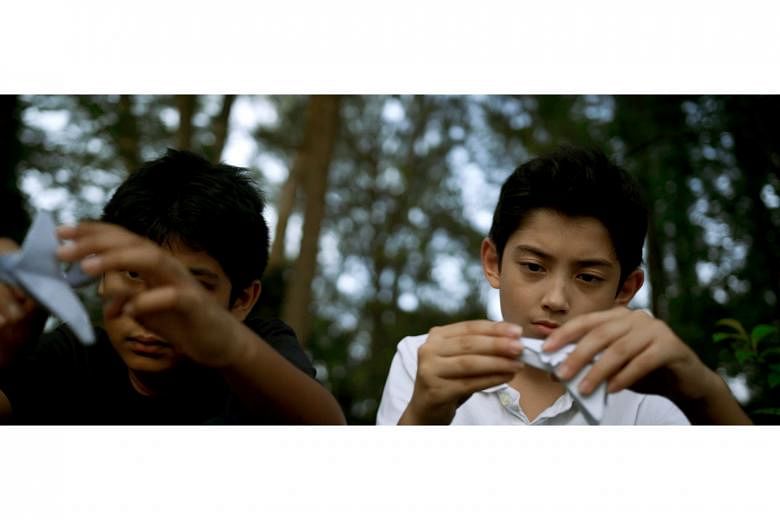 Dharshan Nathan (far left) and Kaiden Quinn (left) in a still from We Will Burn, a short film by Amanda Tan, based on Ng Yi-Sheng's poem The Audience. It will be one of eight short films screened at the Poetry Festival Singapore.