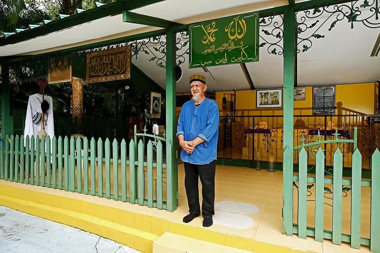 Retiree Zainal Angus at the hut where he tends the tomb of Radin Mas Ayu - a Javanese princess who was killed while trying to shield her father, according to folklore.