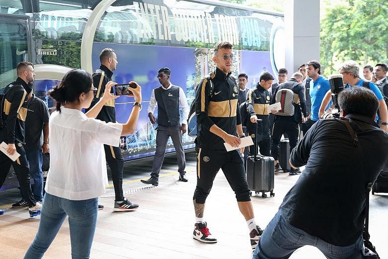 Left: Inter Milan's Ivan Perisic arriving at the hotel yesterday with his teammates. The Italian club will be playing against Manchester United on Saturday, while Juventus will meet Tottenham on Sunday in the International Champions Cup at the Nation