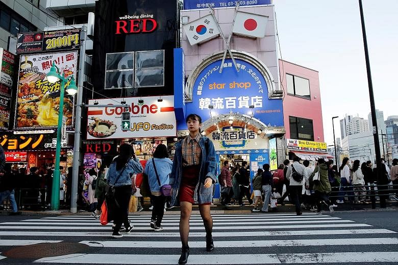 Korean businesses in Tokyo's Shin-Okubo district, which is known as "Korea town", have reported barely a dent in takings since the latest dispute erupted, as South Korean culture remains wildly popular among the Japanese.