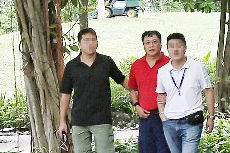 Khoo had reason to kill Ms Cui (above), who was pressing him to repay a $20,000 debt to her. The victim's burnt and decomposed remains were found at Lim Chu Kang Lane 8. Leslie Khoo Kwee Hock (in red) being led to the crime scene at Gardens by the Ba
