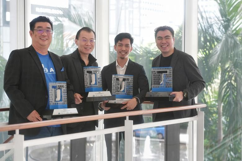 (From left) M-DAQ chief executive Richard Koh, ViSenze CEO Oliver Tan, ThoughtWorks' South-east Asian head of operations and finance Wong Wen Shun and Web Imp's business director Wilson Tan with their firms' awards for Best Tech Companies to Work For