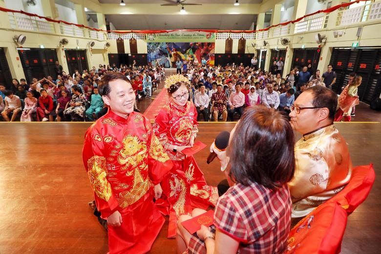 Mock Indian, Malay and Chinese (above) wedding ceremonies being performed by the staff and students of Chua Chu Kang Secondary School in celebration of Singapore's diversity, with Minister for Education Ong Ye Kung looking on. 