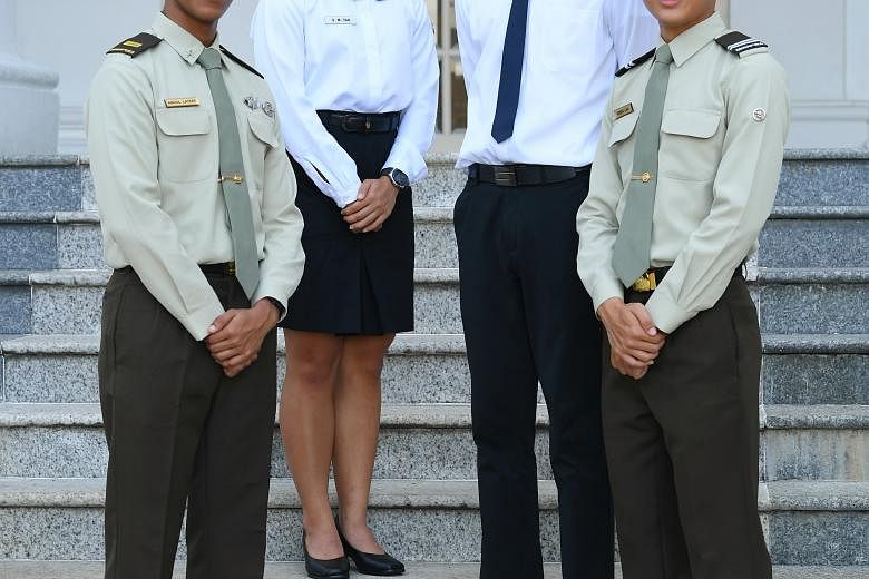 Defence scholarship recipients (from far left) Lieutenant Abdul Lateef Mohamed Nasim, Midshipman Allison Tan Sue Min, Mr Alvin Tan and Officer Cadet Keefe Lau at the Istana yesterday.