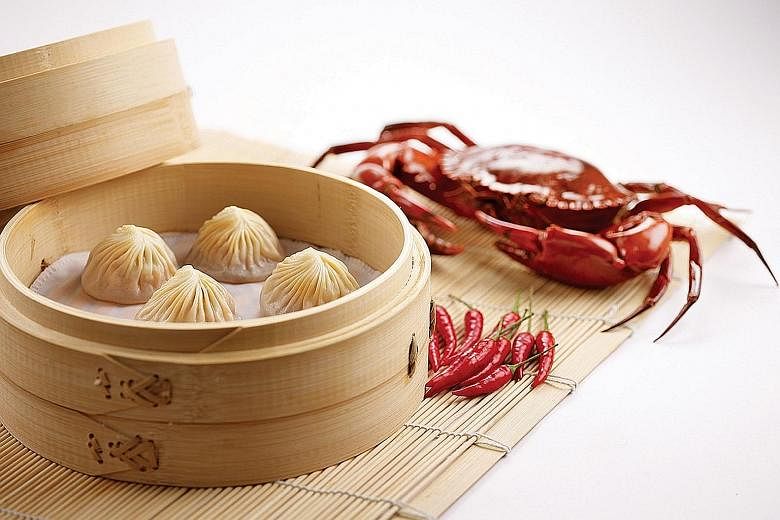DIN TAI FUNG Steamed chilli crab & pork xiao long bao, $8 for four pieces