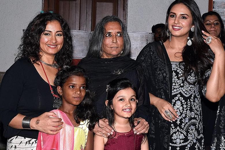 From left: Bollywood actress Divya Dutta, director Deepa Mehta, and actress Huma Qureshi posing for photographs with young actors at the premiere of Netflix's Indian original series Leila, in Mumbai last month. Competition from both global and local 