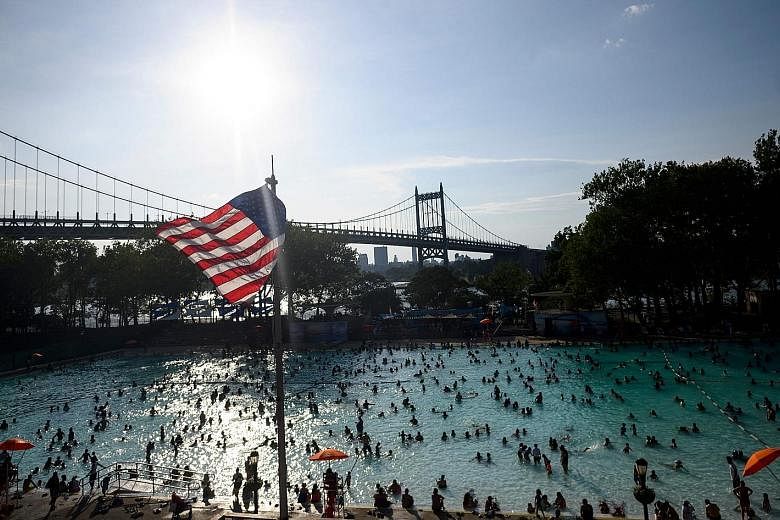 Crowds at a public swimming pool in New York City over the weekend as the US was hit by extremely hot weather, with daytime temperatures forecast to approach 38 deg C across a number of major cities.