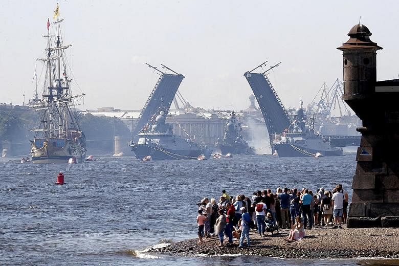 The Russian Navy's small missile corvettes (from far right) Serpukhov, Passat and Mytishchi as well as sailboat Poltava taking part in a rehearsal for Russia's Navy Day parade in St Petersburg yesterday. Navy Day is celebrated on the last Sunday of J