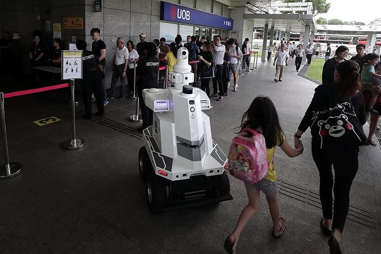 An ST Engineering roving robot with surveillance capabilities deployed during "Exercise Station Guard" at the Hougang MRT Station last December. Innovation is a big part of the defence technology group's growth plan, says Mr Vincent Chong, its president a