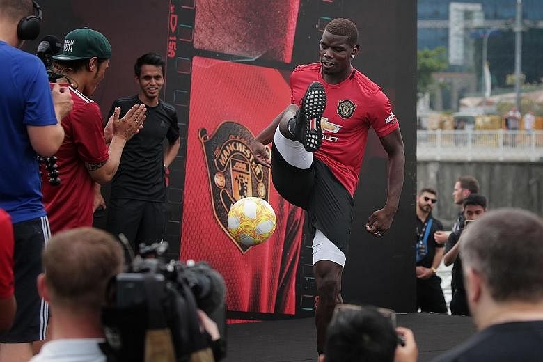 Paul Pogba showing off his ball-juggling tricks at a sponsor's event at The Float @ Marina Bay.