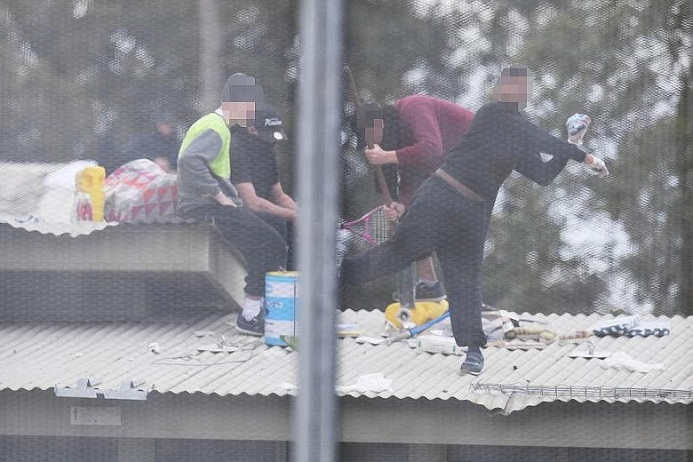 Detainees rioting at the Frank Baxter Juvenile Justice Centre in Kariong, Australia, yesterday. The incident involved up to 20 male inmates aged 16 to 20 who have all been detained, NSW Police said. Six inmates - two stabbed and four badly beaten - a