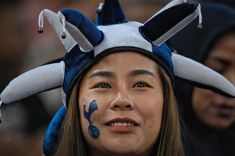 Other fans of the Champions League finalists were decked out in Spurs' colours, in gear and face paint, for the game against Juventus.  