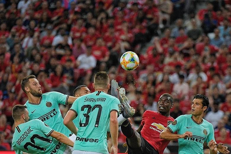 Midfielder Paul Pogba took on a host of Inter Milan players as Manchester United ran out 1-0 winners on Saturday, with the English side's supporters filling the National Stadium on their team's first visit to Singapore since 2001.