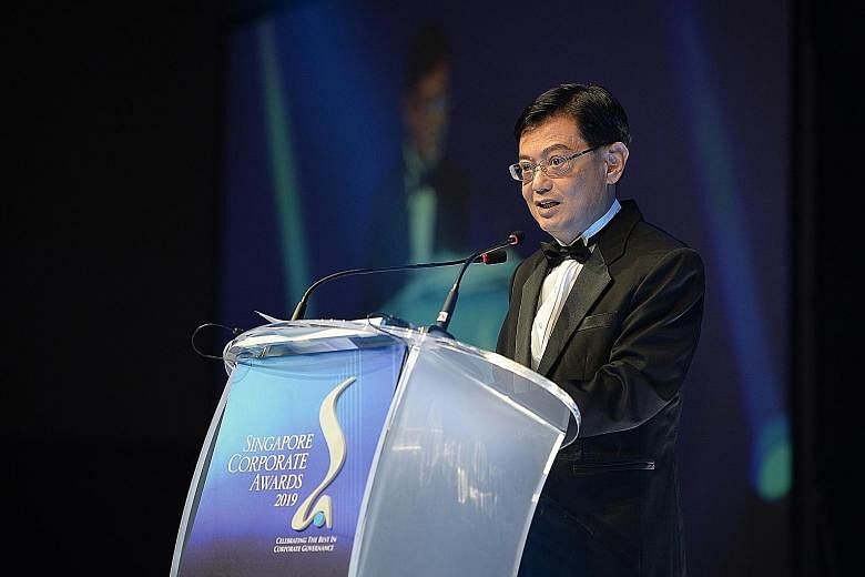 Deputy Prime Minister Heng Swee Keat speaking at the Singapore Corporate Awards event at Resorts World Convention Centre last night. He said the Government will continue to partner businesses to promote forward-looking, pro-business regulations and p
