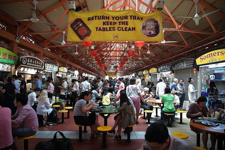 Diners can redeem sets of reusable cutlery (on a first-come, first-served basis) at selected hawker centres such as Maxwell Food Centre (left).