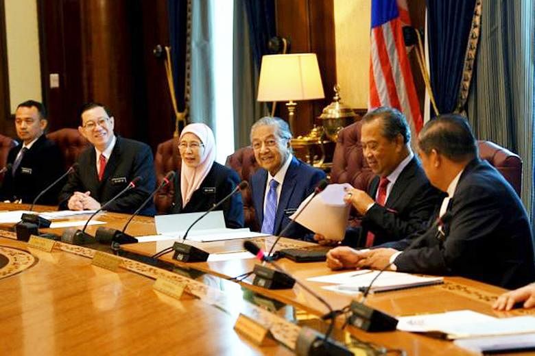 Prime Minister Mahathir Mohamad (centre) with other Cabinet members (from far left) Education Minister Maszlee Malik, Finance Minister Lim Guan Eng, Deputy Prime Minister Wan Azizah, Home Minister Muhyiddin Yassin and Defence Minister Mohamad Sabu. P