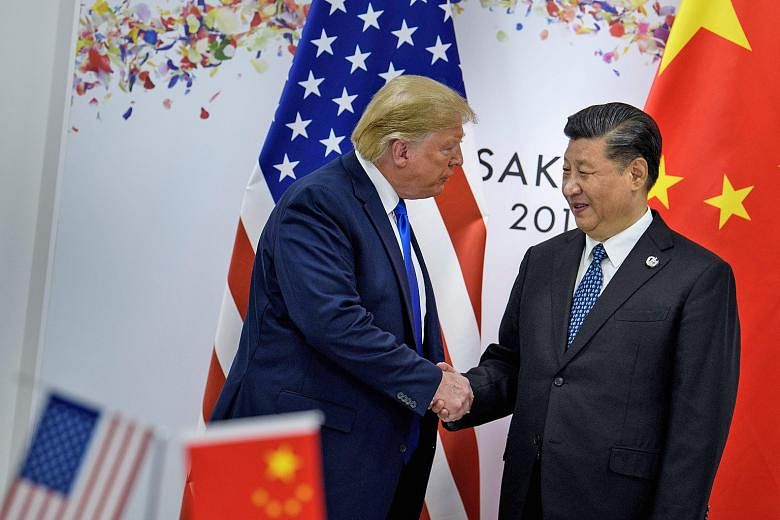 US President Donald Trump and Chinese President Xi Jinping before their bilateral meeting on the sidelines of the Group of 20 summit in Japan last month. PHOTO: AGENCE FRANCE-PRESSE